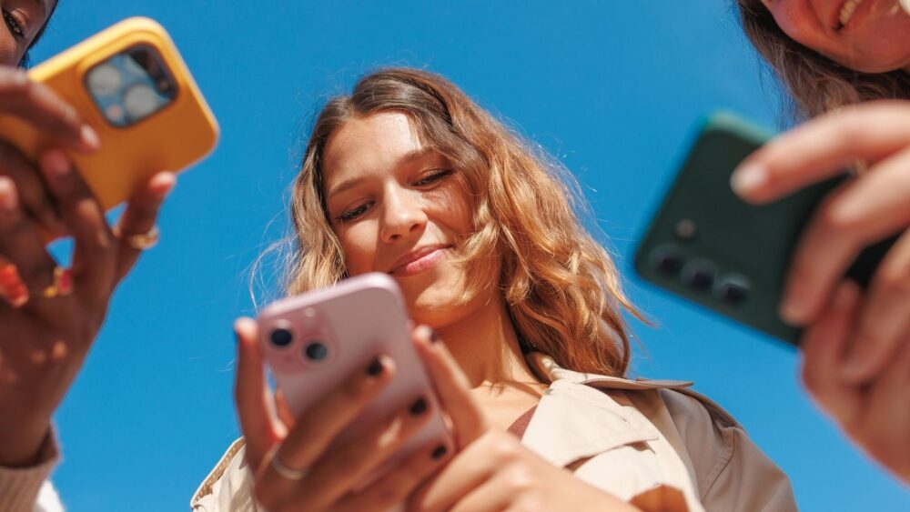 group-of-women-looking-at-phones